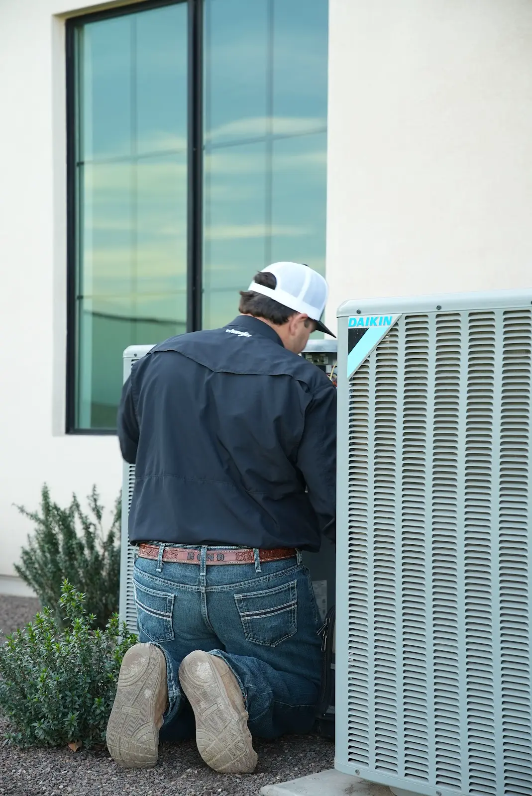 Chandler Air Mechanical technician working on an outdoor AC unit